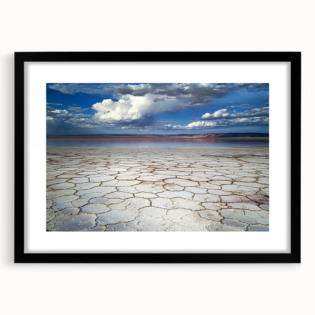 Abstract landscape art print framed in black with a white mat, showcasing vibrant colors and dynamic shapes, perfect for modern home decor.
