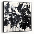 Framed canvas artwork showcasing an abstract splatter design in shades of black, displayed from a side view, perfect for modern home decor.
