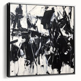 Framed canvas artwork showcasing an abstract splatter design in shades of black, displayed from a side view, perfect for modern home decor.