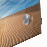 Close-up of a vibrant acrylic landscape painting depicting a desert scene with rich colors and intricate details, highlighting the texture of the glass surface, perfect for modern home decor.