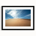 Desert landscape framed art with a black mat, showcasing warm earthy tones and intricate details, ideal for enhancing home decor in modern settings.