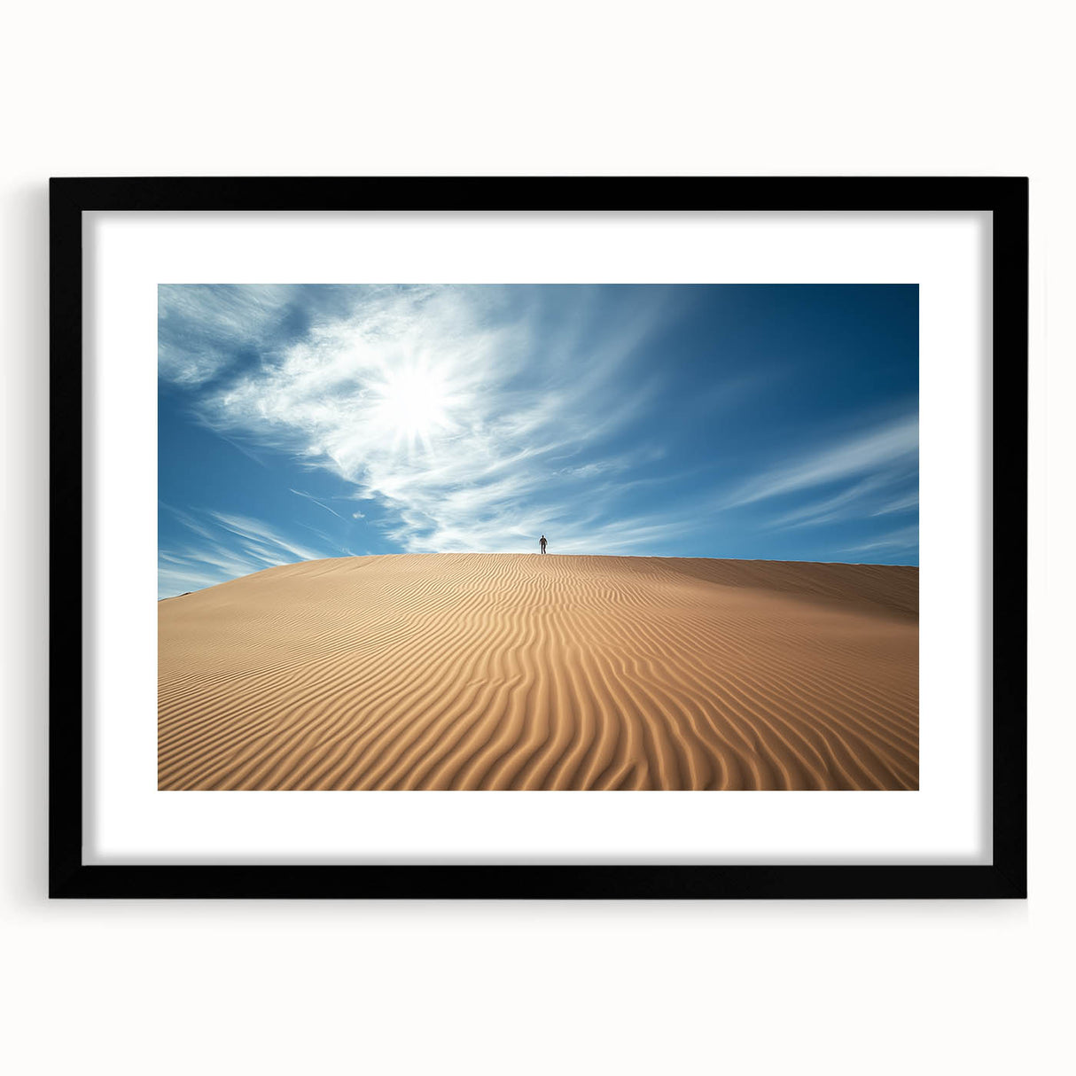 Desert landscape framed art with a black mat, showcasing warm earthy tones and intricate details, ideal for enhancing home decor in modern settings.