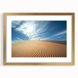 Desert landscape framed artwork with a gold mat, showcasing vibrant earthy tones and intricate details, perfect for home decor or gallery display.