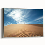 Framed canvas artwork depicting a serene desert landscape with vibrant orange and soft blue hues, featuring a sleek silver frame, ideal for modern decor.