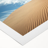 Desert landscape rolled canvas artwork showcasing warm hues of orange and yellow, depicting a serene sunset over sand dunes, perfect for home decor.