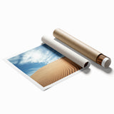 Desert landscape rolled canvas print showcasing vibrant hues of orange and blue, perfect for home decor. Packaged securely in a cardboard tube for delivery.