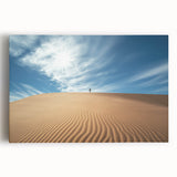Desert landscape stretched canvas depicting vibrant orange and yellow hues of a sunset over sand dunes, perfect for home decor or art collection.