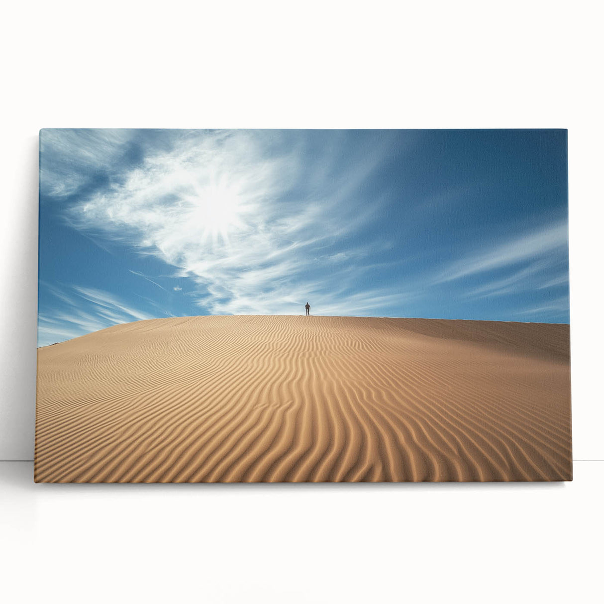 Stretched canvas artwork depicting a vibrant desert landscape, featuring warm hues of orange and brown with cacti silhouetted against a sunset sky, perfect for modern home decor.