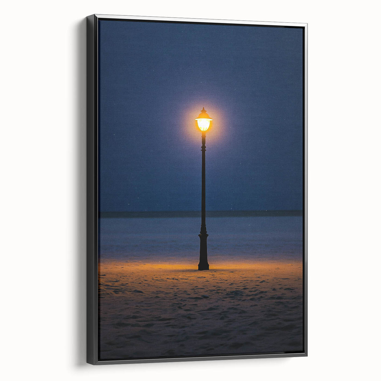 Framed canvas artwork depicting serene sand dunes in warm tones, showcasing a black frame and side view, perfect for enhancing modern home decor.