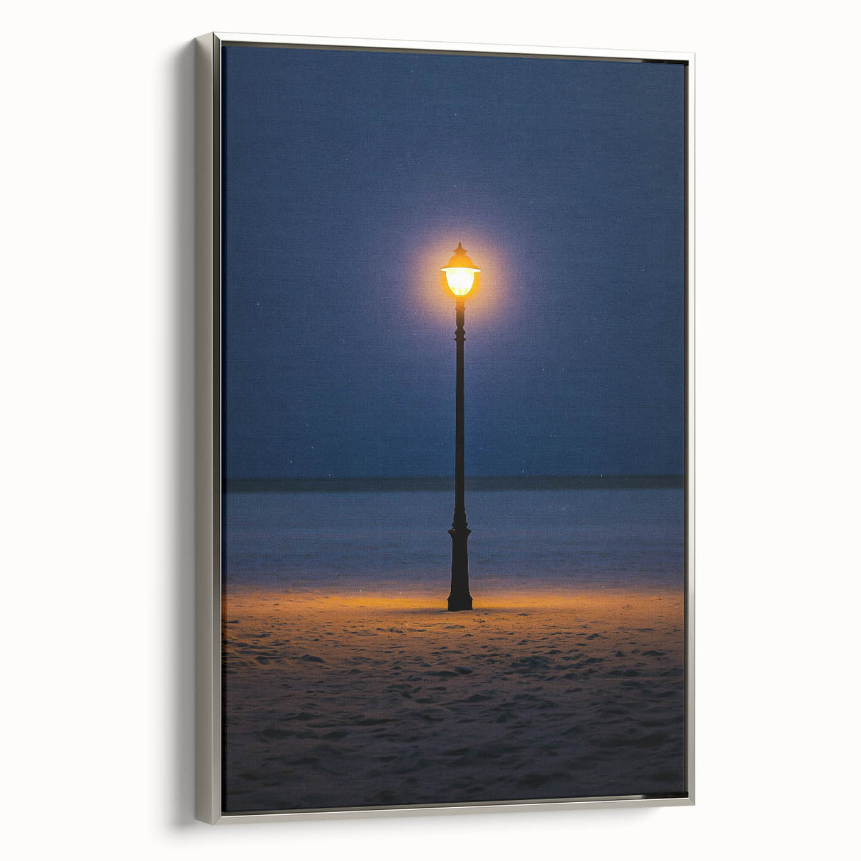 Framed canvas artwork depicting serene sand dunes in a desert landscape, showcasing soft beige and gold tones with a silver frame, ideal for modern home decor.