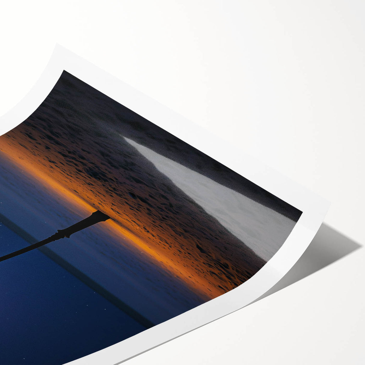 Vibrant rolled canvas print depicting serene sand dunes under a blue sky, showcasing warm beige and golden hues, elegantly packaged in a protective tube.