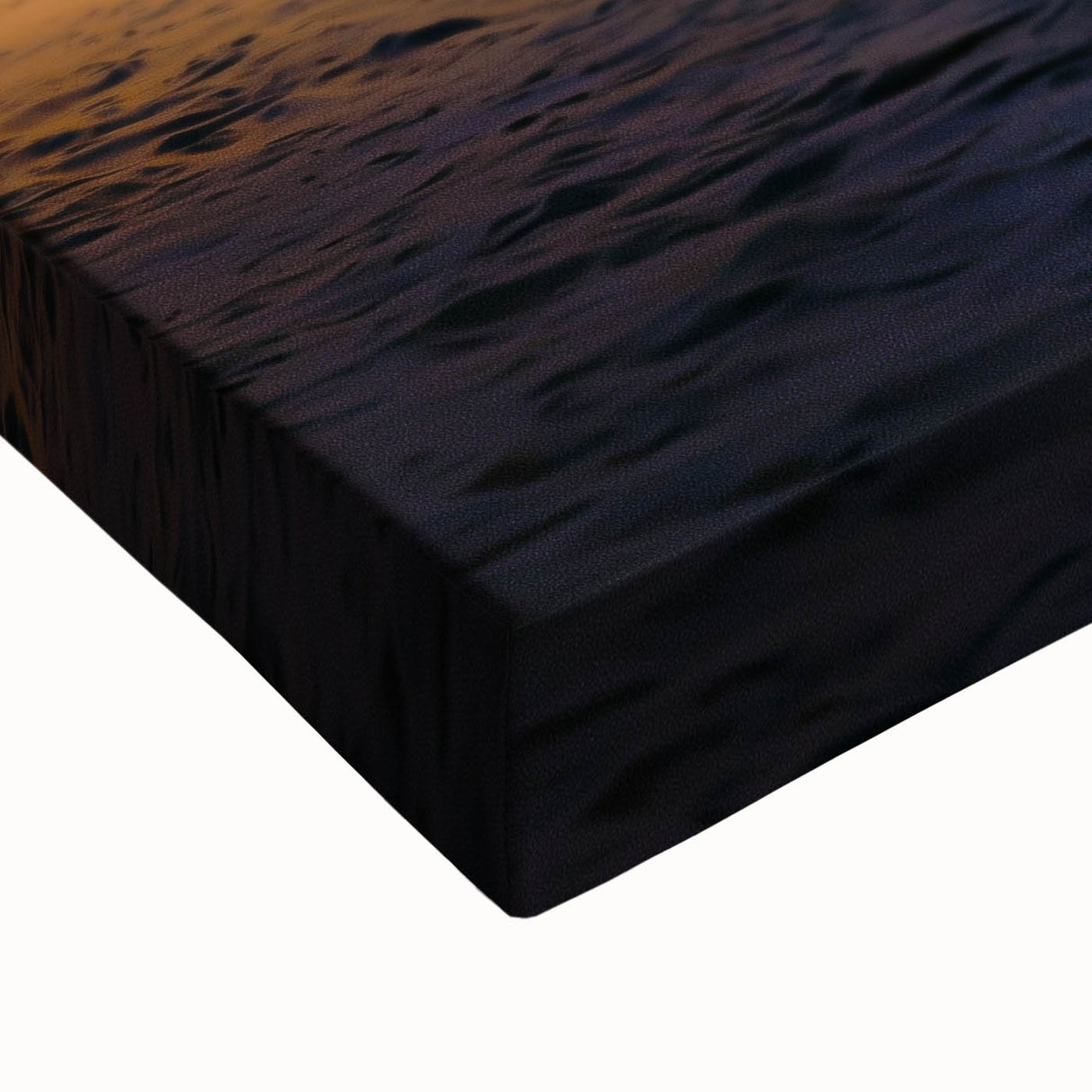 Close-up of a stretched canvas artwork showcasing vibrant desert dunes at sunset, highlighting the rich textures and warm color gradients ideal for home decor.