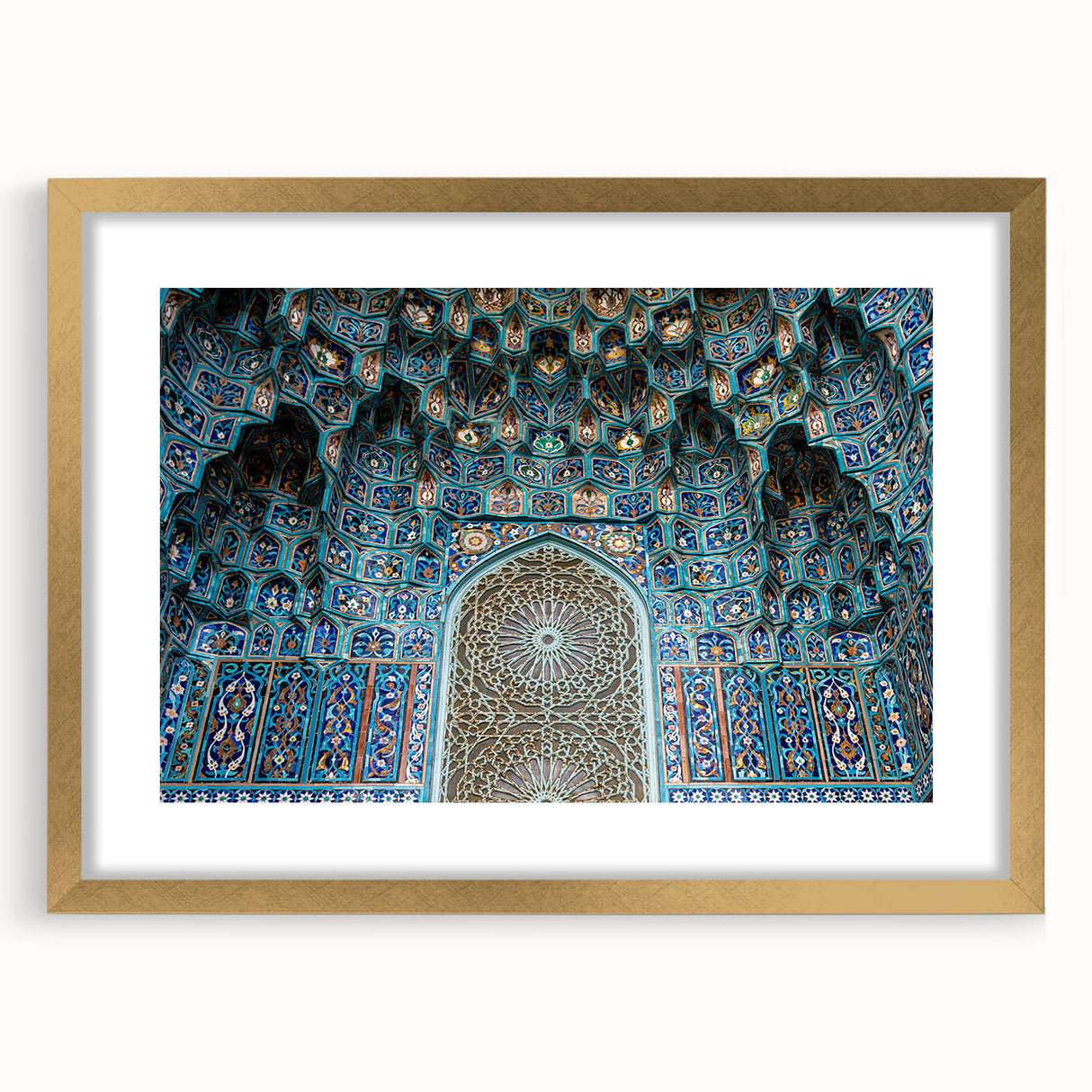 Textured abstract art print depicting a Moroccan landscape in earth tones, framed in gold, suitable for bedroom decor.