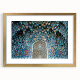 Textured abstract art print depicting a Moroccan landscape in earth tones, framed in gold, suitable for bedroom decor.
