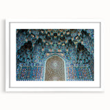 Extra large wall art featuring an abstract depiction of a Moroccan landscape in textured earth tones, framed in white.