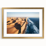 Textured abstract art print of African scenery in muted earth tones, framed in gold, ideal for bedroom art.