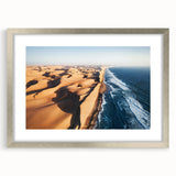 Abstract art print depicting a Namibian landscape in muted earth tones on a framed canvas, suitable for dining room decor.