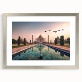 Textured abstract art print of a serene landscape in muted earth tones, framed in silver, ideal for bedroom ambiance.