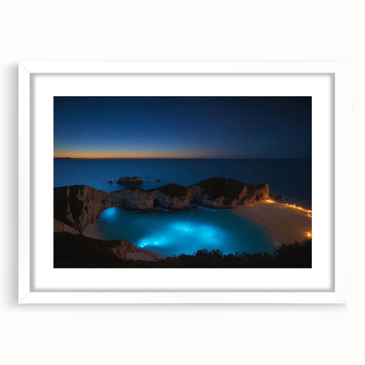 Textured abstract art print of a Caribbean scenery in muted blue and green tones on a framed white mat.