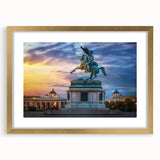 Abstract art print of a European scenery in muted gold and green tones, framed with a gold mat.