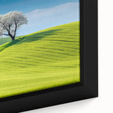 Close-up of extra large framed canvas depicting a textured, colorful European cityscape in predominantly black tones.