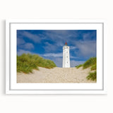 Textured abstract art print of European scenery in muted earth tones, framed with a white mat, suitable for bedroom decor.