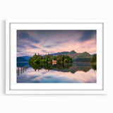 Textured art depicting abstract scenery of Cumbria, England, in muted earth tones on a framed white mat.
