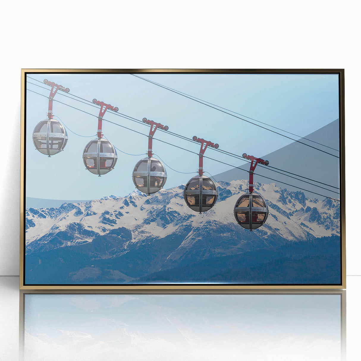 Art deco poster of the French Alps in muted green and blue tones, acrylic print in gold frame.