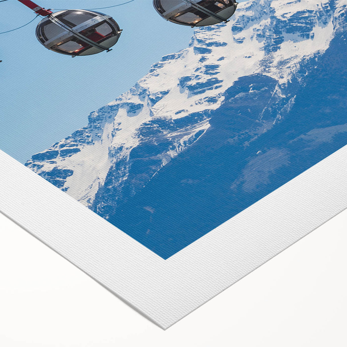 Art deco poster of the French Alps in muted blues and whites on rolled canvas, suitable for dining room wall art.