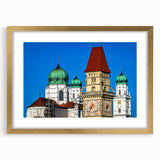 Abstract art print of a Bavarian landscape in muted green and blue shades, framed in gold.