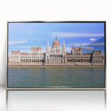 Large art print of a European scenery in Hungary, featuring muted earth tones on a silver-framed acrylic.