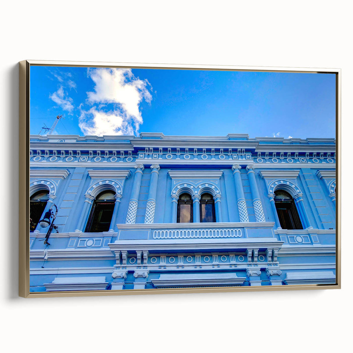 Framed canvas depicting a vintage-style landscape of Mexico's Yucatan in black and gold tones, suitable for bedroom decor.