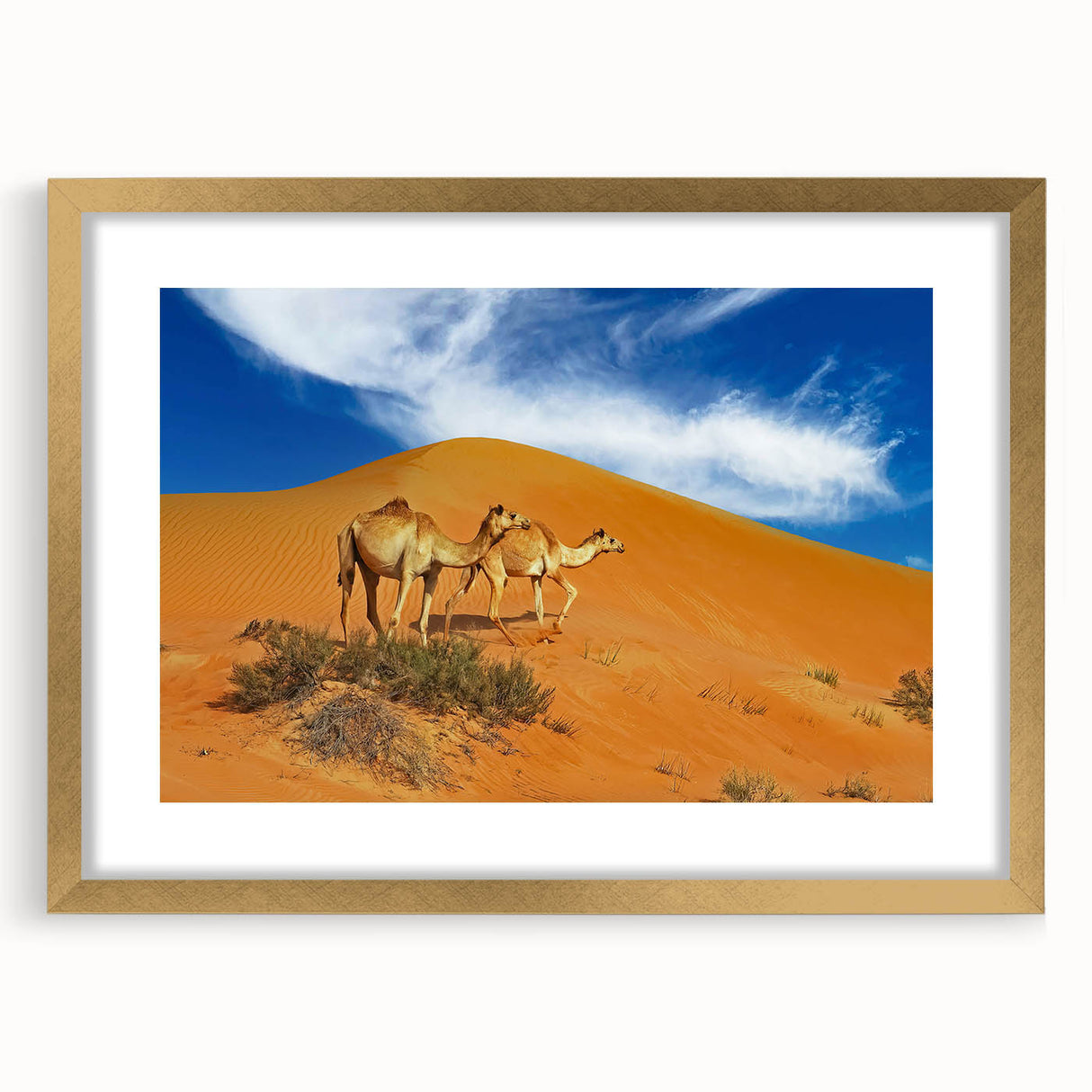 Extra large abstract art print depicting Middle Eastern scenery in textured gold tones, framed with a mat.