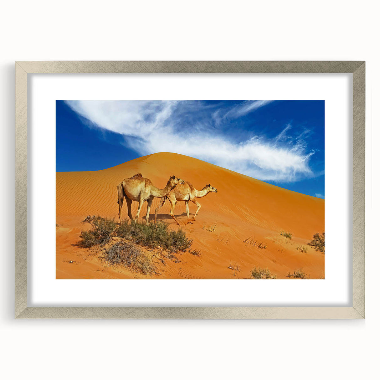 Textured abstract art print of a Middle Eastern landscape in muted earth tones, framed in silver, ideal for bedroom decor.