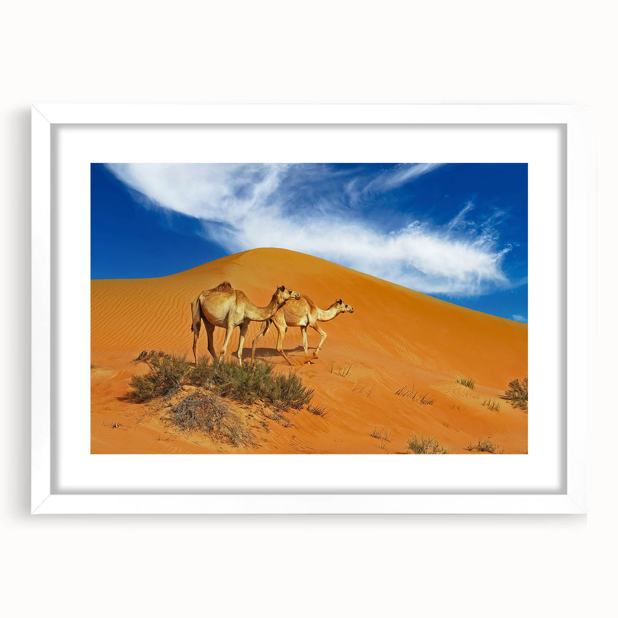 Abstract art print depicting a Middle Eastern scenery in muted earth tones on a framed white mat.