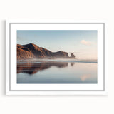 Abstract art print of Auckland's skyline in muted gray and blue tones on a white framed canvas.