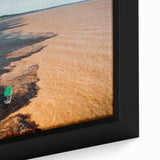 Extra large framed canvas featuring a textured depiction of a South American scenery in black with colorful art accents.