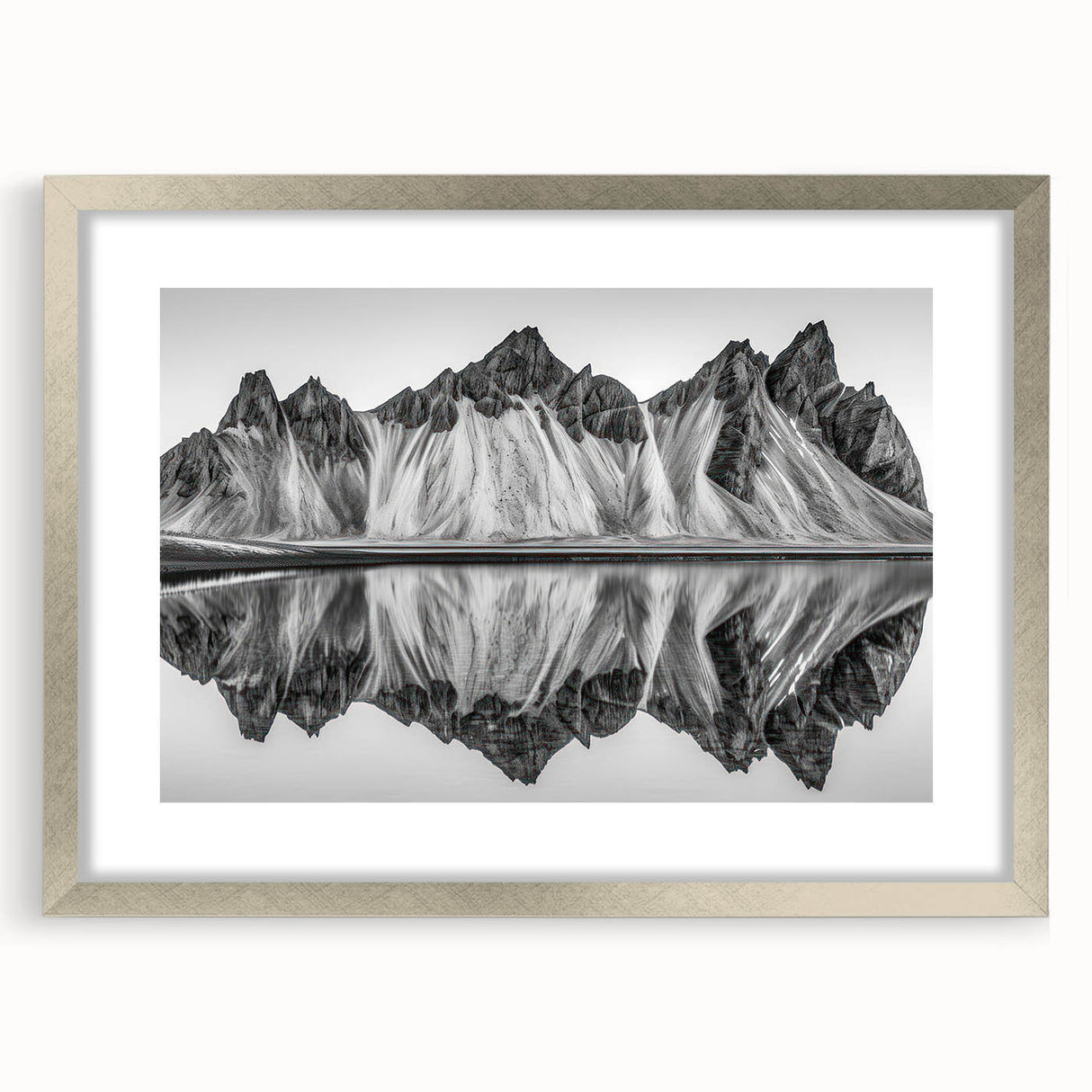 Textured art depicting abstract Alaskan scenery in muted gray and silver tones, framed with a silver mat.