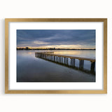 Extra large abstract art print featuring textured swirls in gold and white hues, framed in gold, ideal for living room decor.