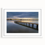 Abstract art print featuring Daytona scenery in muted blue and green tones on a white framed canvas.