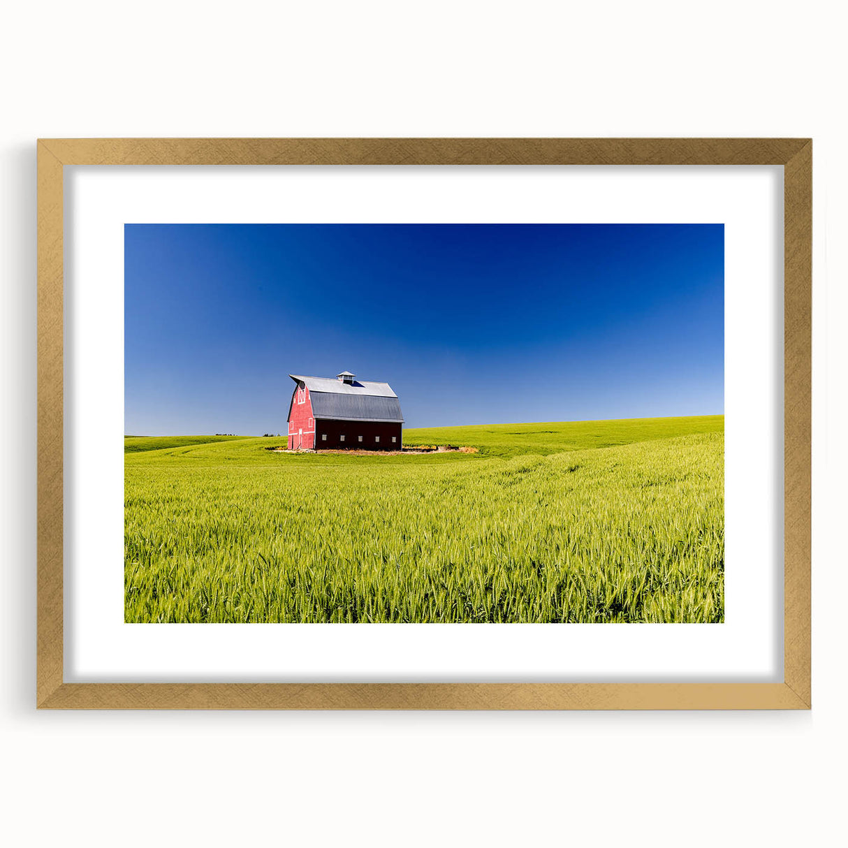 Extra large abstract art print of Idaho scenery in muted earth tones on a textured canvas, framed in gold.