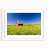 Abstract art print of Idaho scenery in muted earth tones on a framed white mat, ideal for dining room decor.