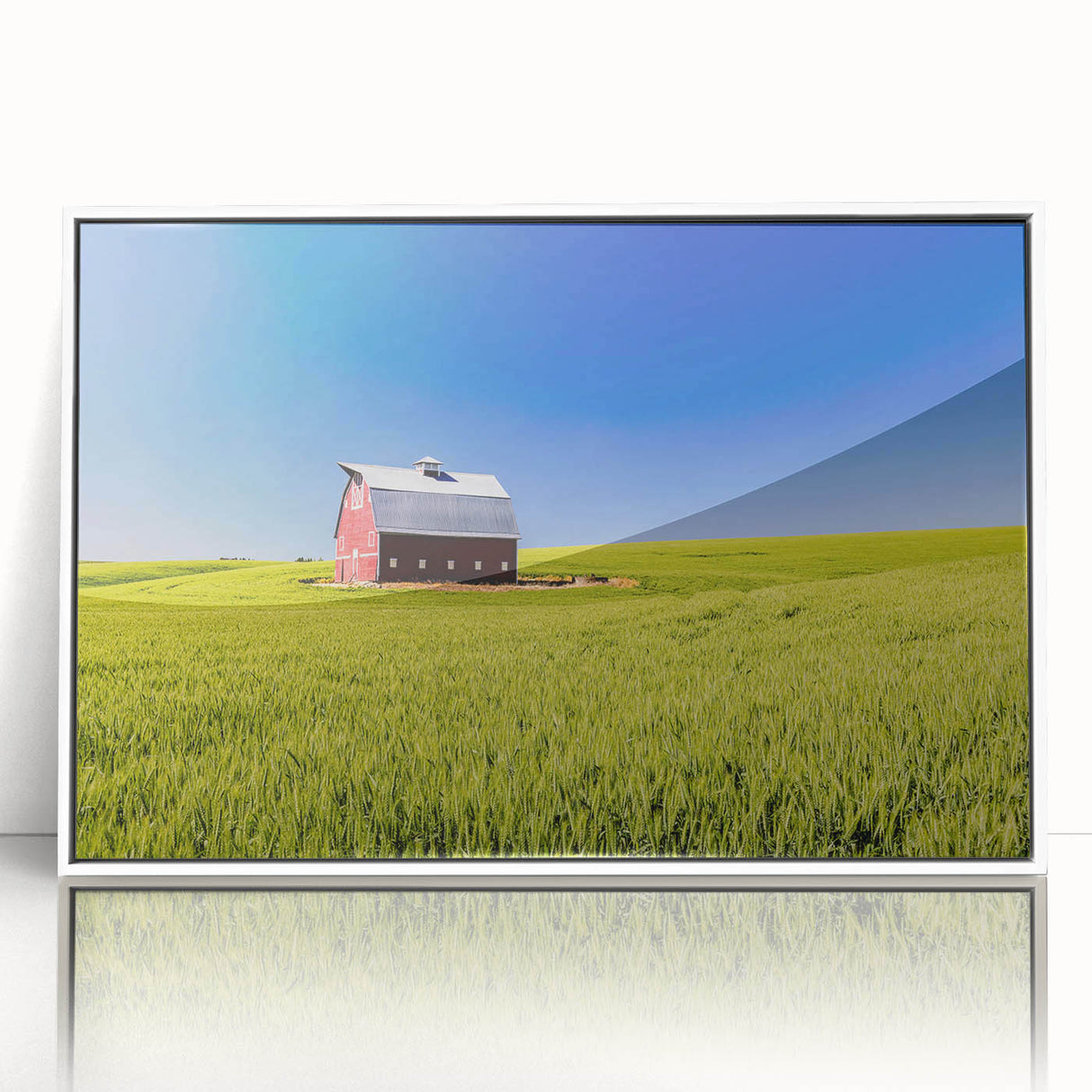 Acrylic print of Idaho scenery in art deco style, with muted earth tones, framed in white.