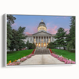 Vintage poster art of Maine scenery on a framed canvas, featuring colorful art in a black frame.