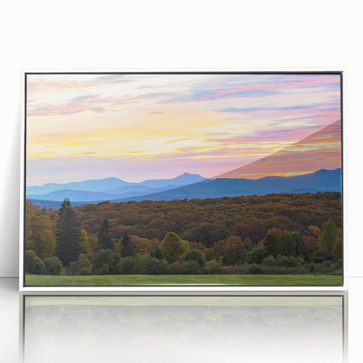 Acrylic print of a serene Vermont landscape in muted green and blue tones, framed in white.