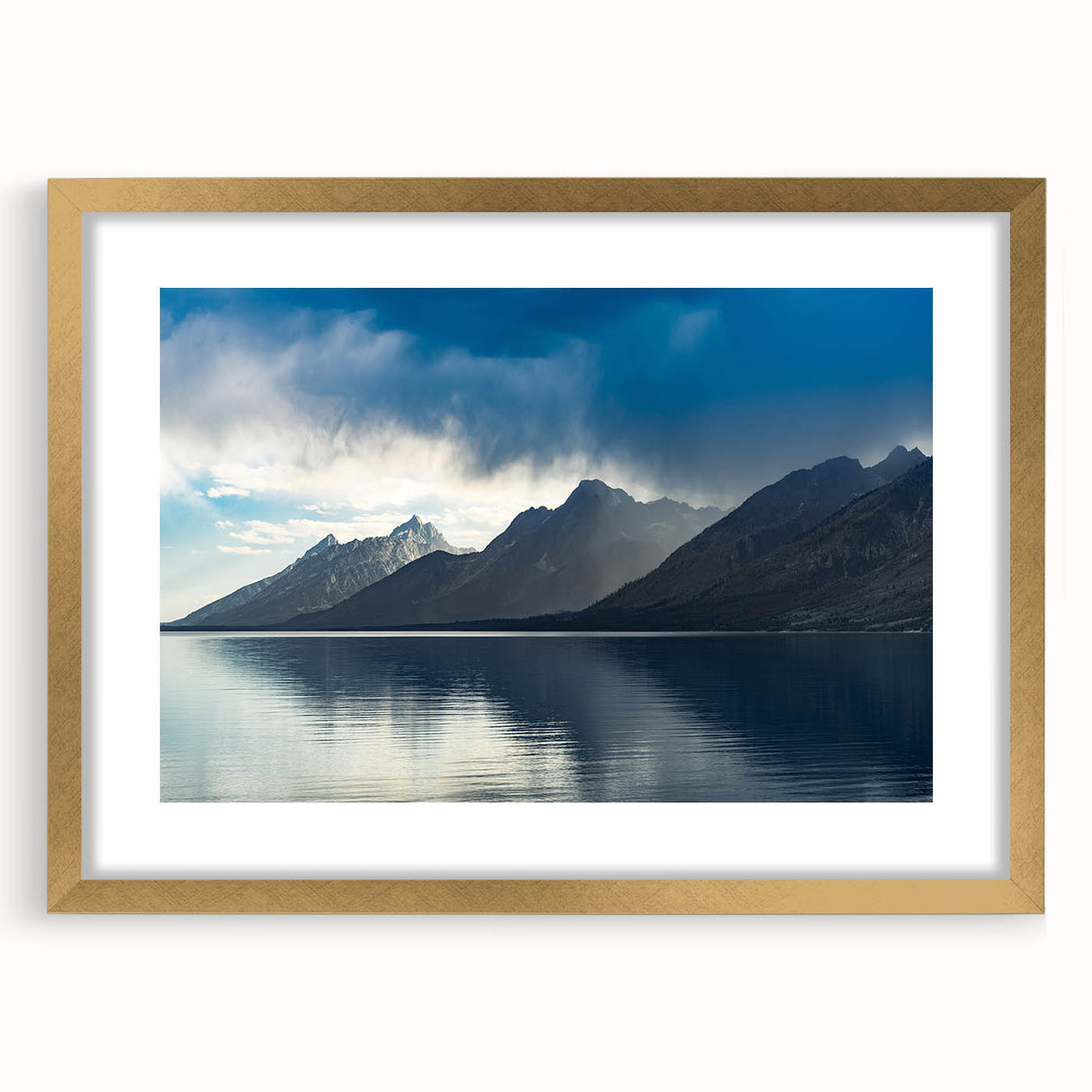 Extra large wall art featuring an abstract print of the Grand Tetons, in textured tones of blue and gray, framed in gold.