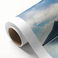 Art deco poster of the Grand Tetons in muted green and blue tones on rolled canvas, ideal for nursery wall art.