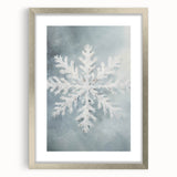 Textured art print of abstract winter scene in muted blue and white, framed in silver, ideal for bedroom wall decor.