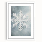 Abstract art print depicting a winter scene in muted blue and gray tones on a white framed canvas.