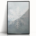 Large abstract wall art depicting a winter scene in muted blue and white tones, framed in black acrylic.